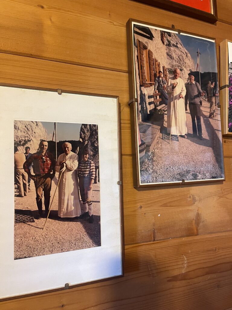 Pictures on a wall in Rifugio Calvi of Pope John Paul meeting with people at Rifugio Calvi