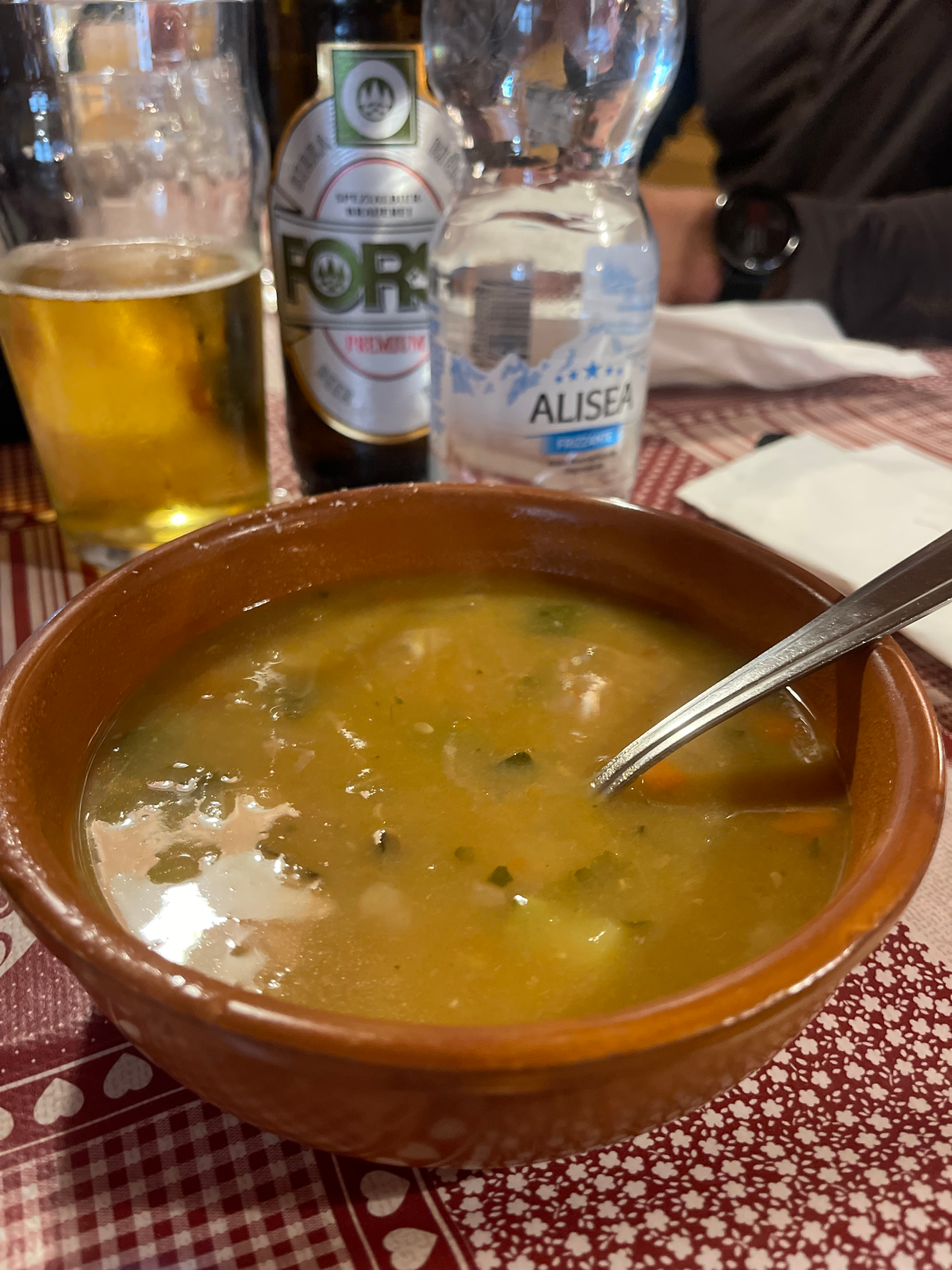 a brown bowl filled with soup being served for dinner at Rifugio Pradidali 
