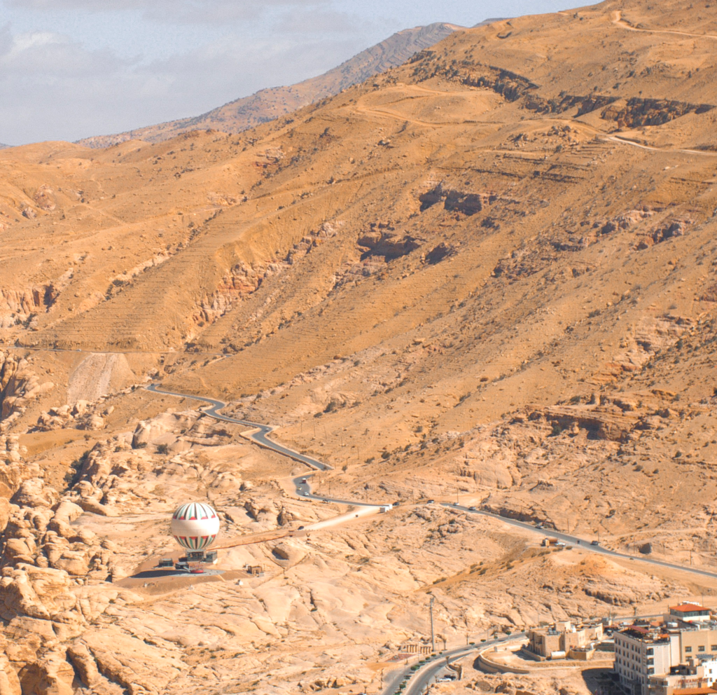 Petra from above while a hot air balloon sits