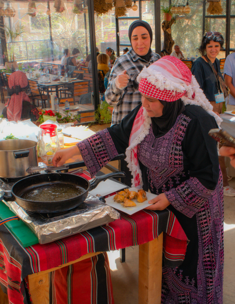 a woman in a traditional dress and headwrap of jordan is cooking maqluba