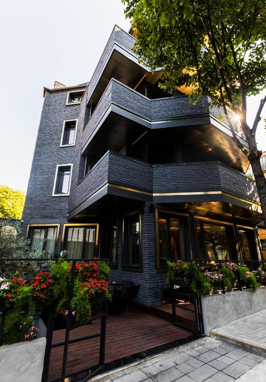 front of modern building with balconies the building is black