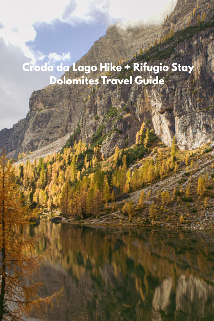 Croda Da Lago with fall foliage on display, reflecting in the background; trees on display arou