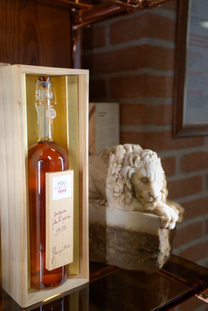 a bottle of grappa oro by Poli grappa on display at Poli grappa museum and shop