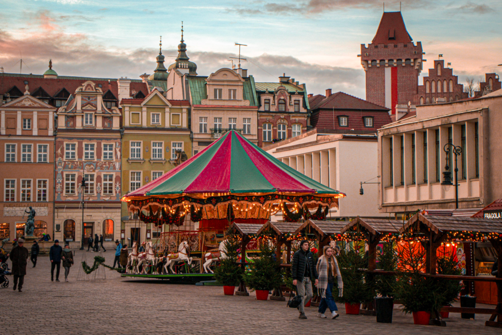 Poznan Christmas MArket with crowds in the old town during the sunset