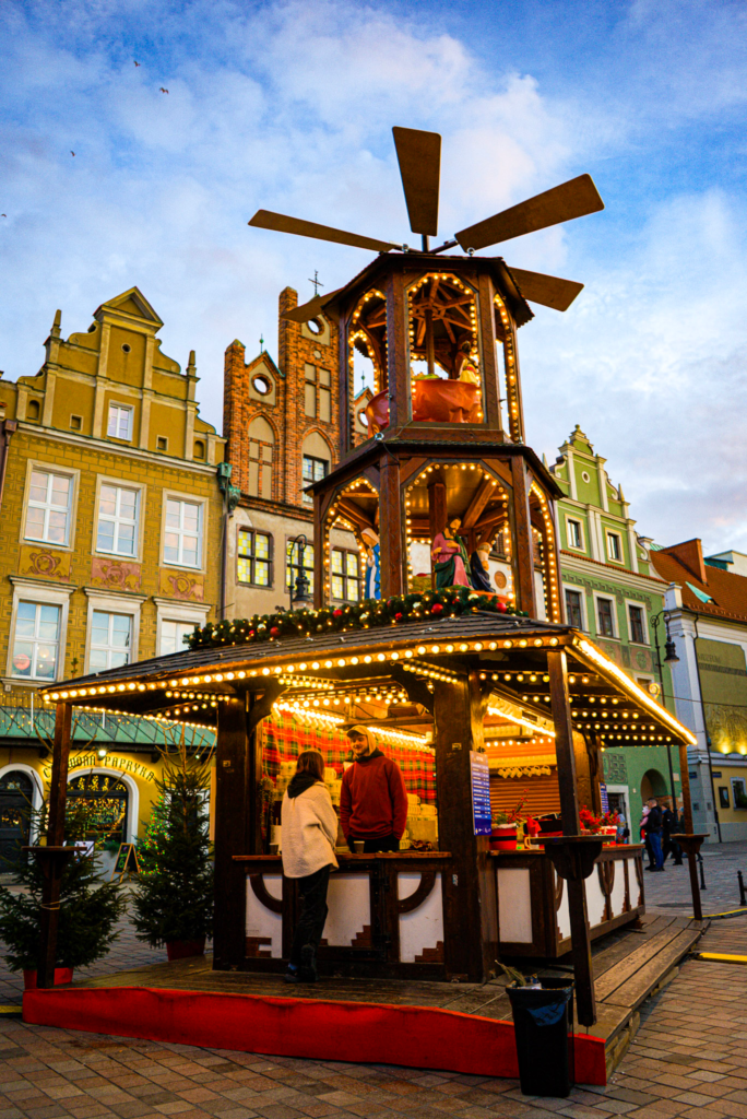 Christmas windmill with poznans beautiful old town surrounding it