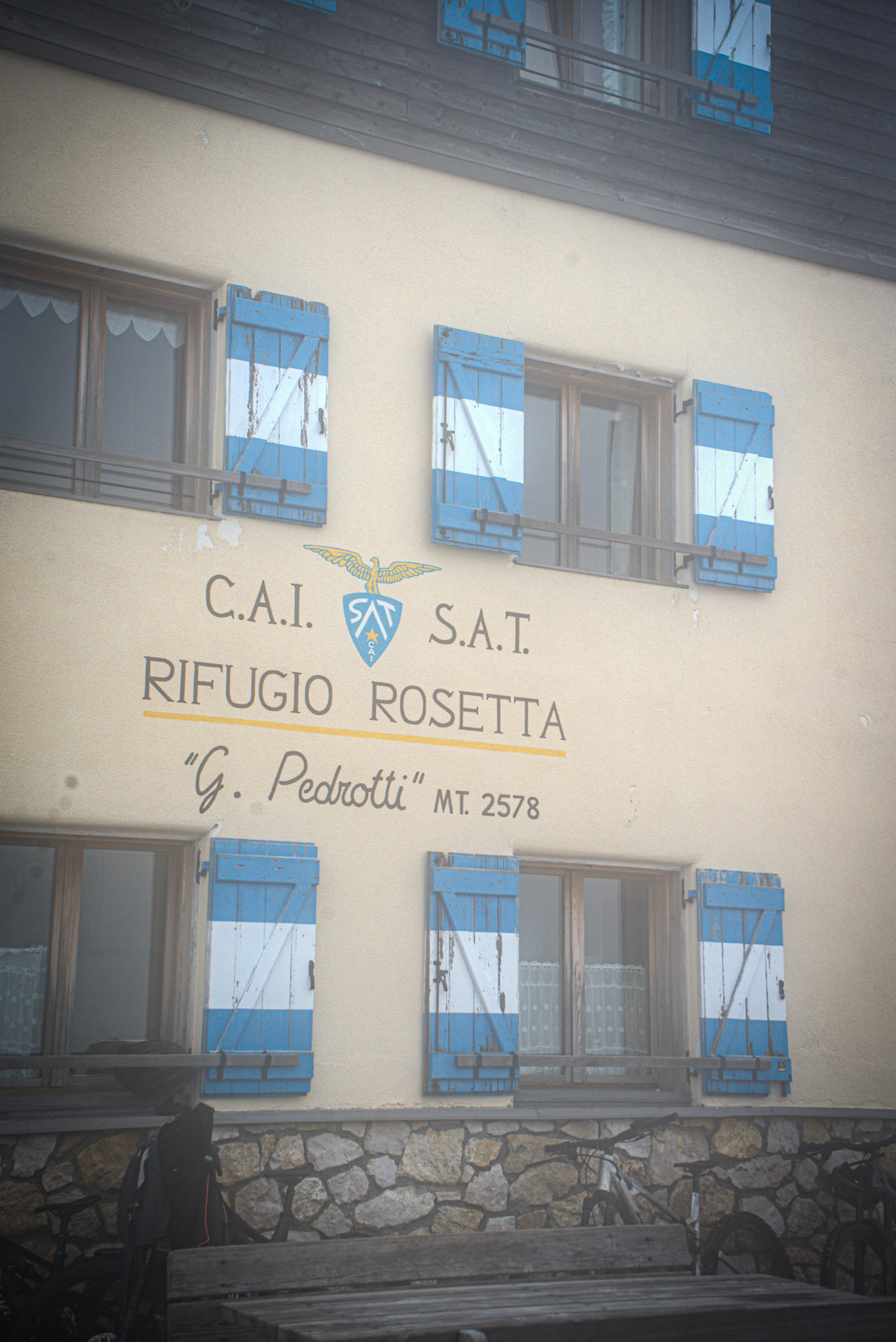 Facade of Rifugio Rosetta that says CAI SAT Rifguio Rosetta