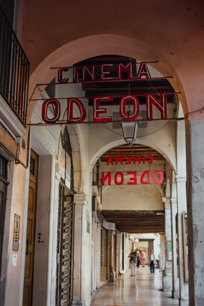 A walkway in Vicenza with the famous Cinema Odeon in the background