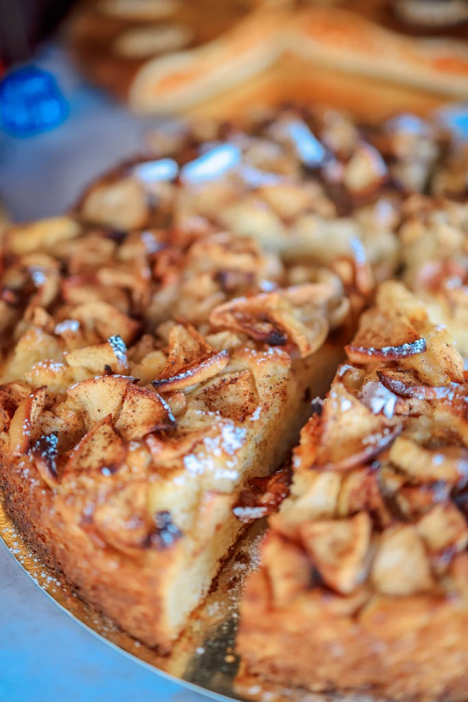 Close-up of a homemade apple cinnamon cake with a slice taken out. Perfect for dessert lovers.