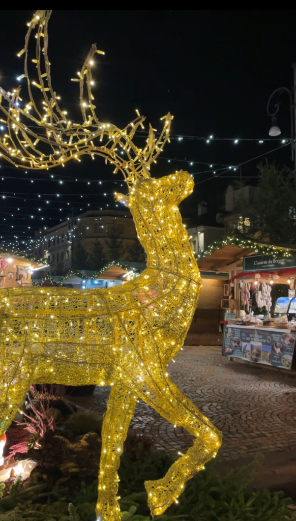 a christmas decoration in the shape of a deer standing proudly at the entrance of the Aosta Christmas Market