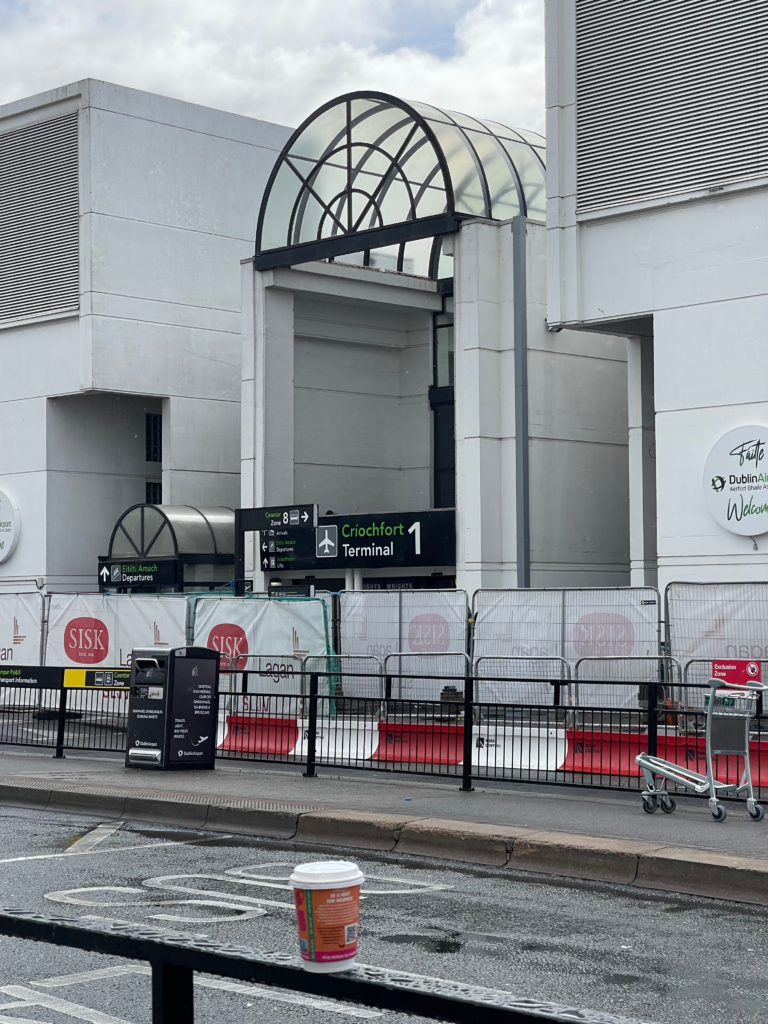 Dublin airport bus departures zone with a white facade