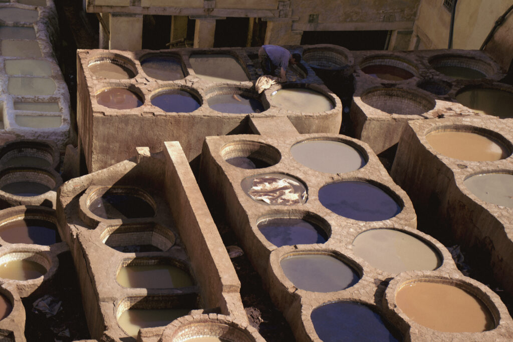 dying pools in fes medina on a hot september day that are filled with various colors