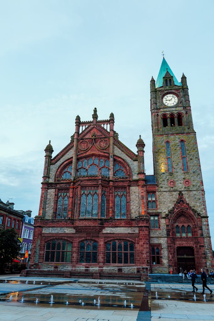The Guildhall in Derry, Northern Ireland, known for its red brick facade and clock tower.