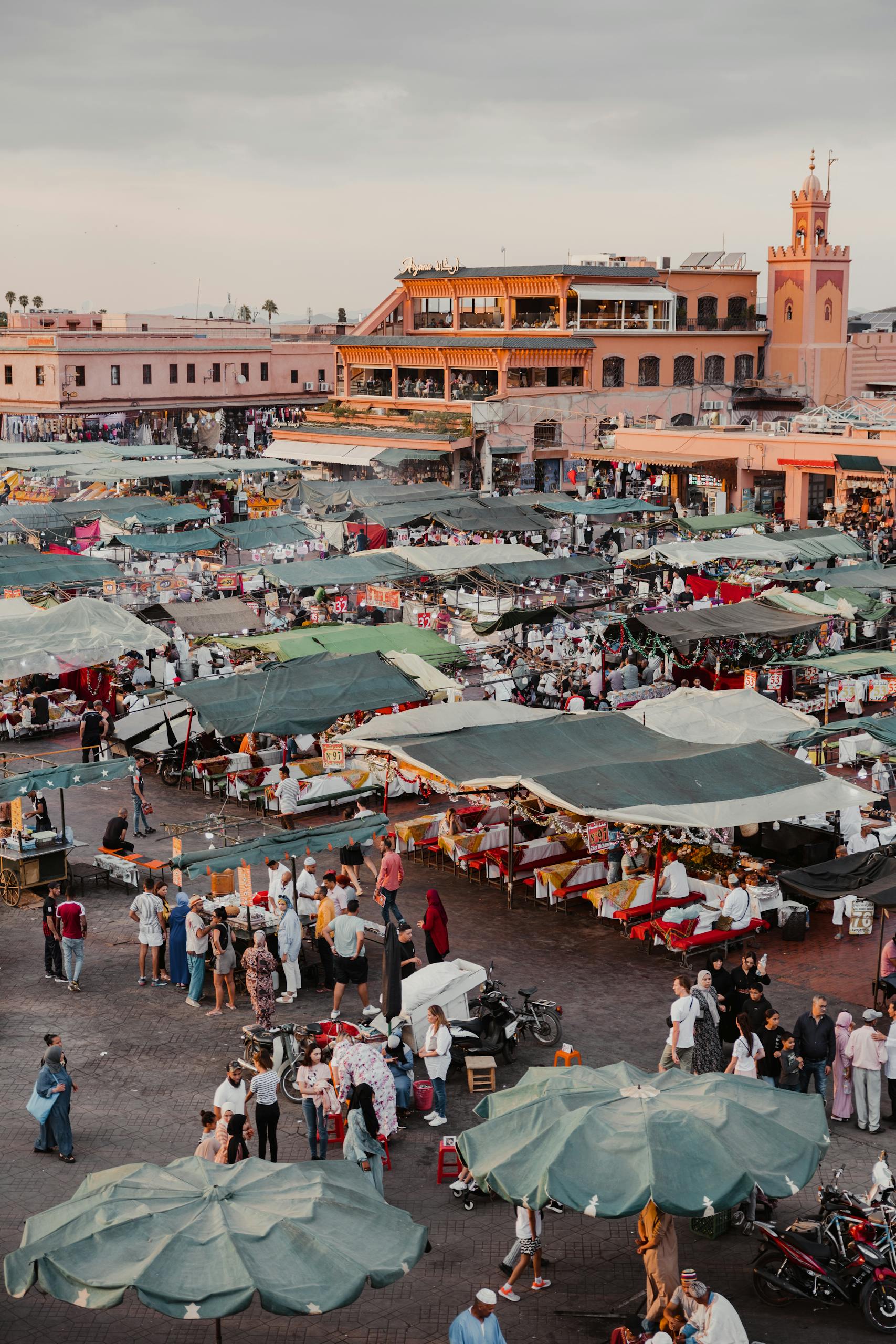 Aerial view of iconic Jemaa el-Fnaa Market in Marrakesh bustling with activity and vibrant stalls.
