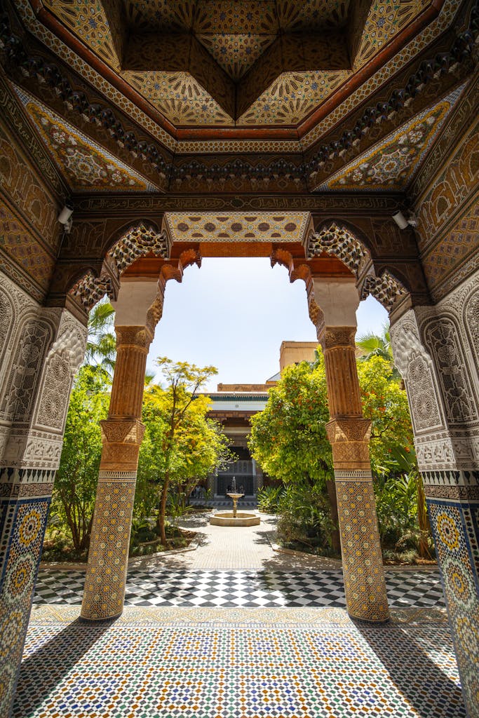 Discover the ornate beauty of Dar El Bacha's courtyard in Marrakech, showcasing Islamic architecture.