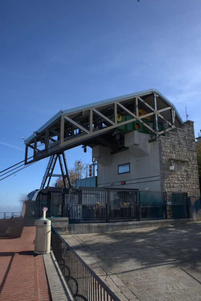 San Marino cable car station with metal framework and gondola cabin at the base of Monte Titano, a convenient way to reach the historic center during 2 days in San Marino.