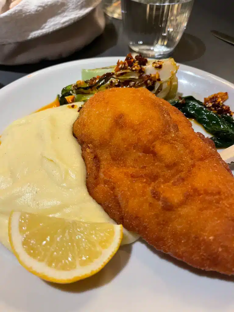 Chicken Kiev with mashed potatoes and spicy bok choy in chili oil from Breg's winter seasonal menu in Ljubljana