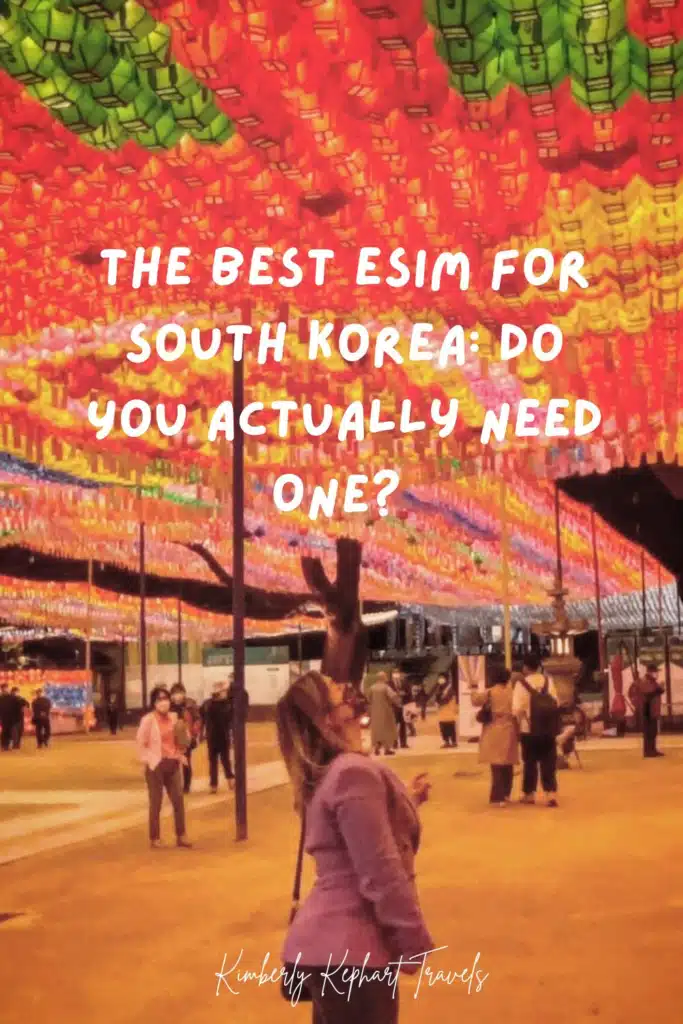 Traveler walking beneath colorful lotus lanterns at a Seoul temple, with overlay text reading the best eSIM for South Korea, do you actually need one.