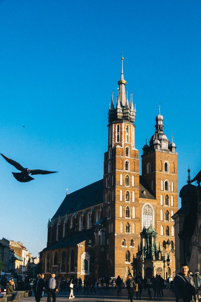 Iconic St. Mary's Basilica in Krakow captured on a clear day, highlighting its Gothic architecture.