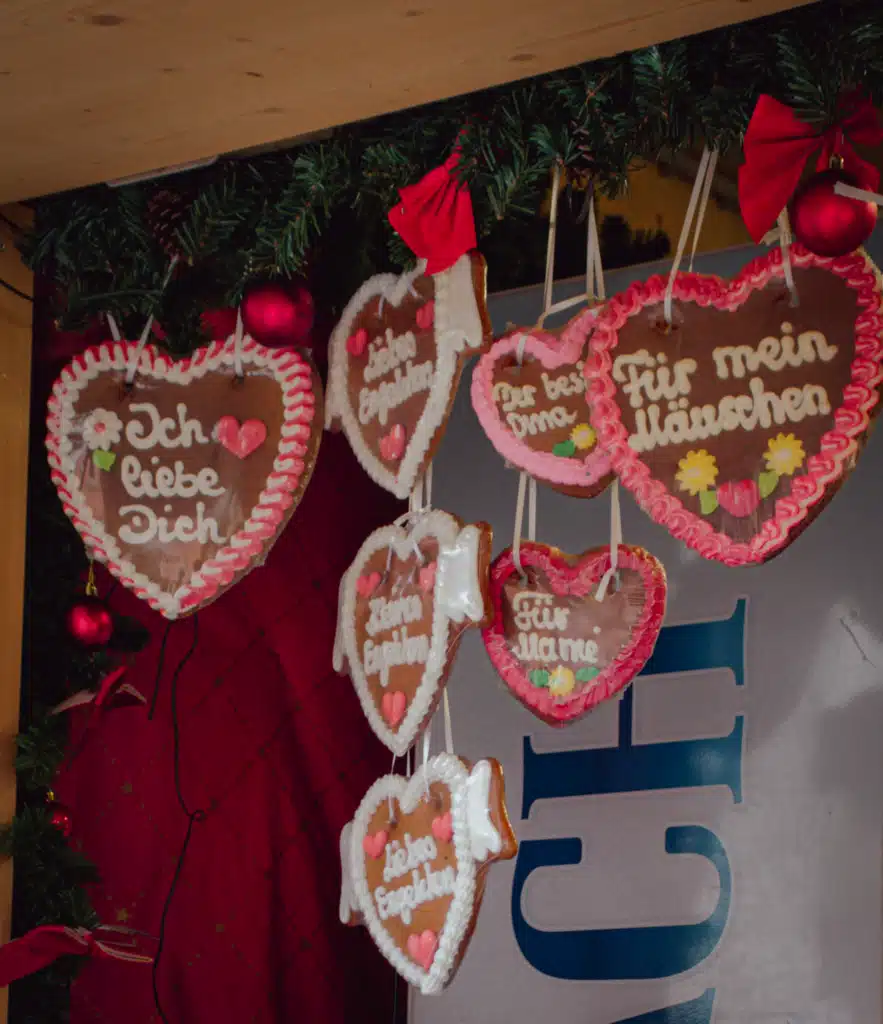 Decorated gingerbread hearts with German phrases hanging at Bregenz Christmas market