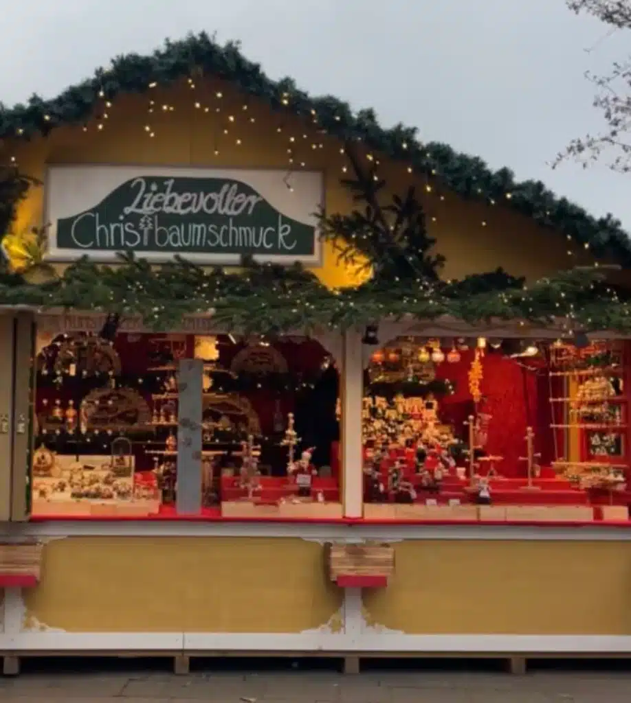 Christmas ornament stall Liebevoller Christbaumschmuck displaying handcrafted decorations at Konstanz market