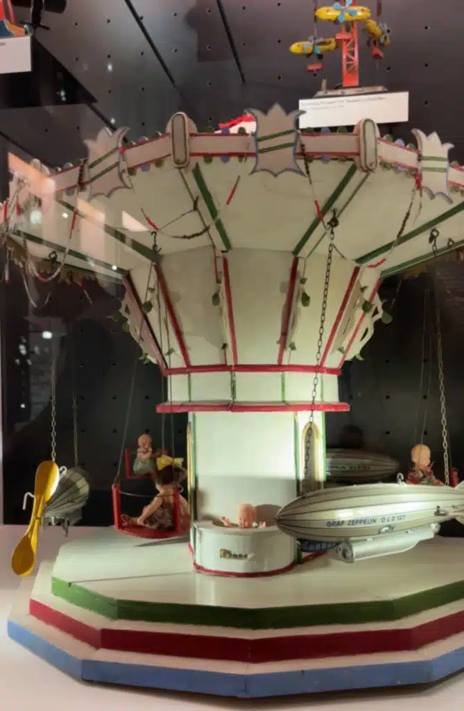 Antique toy carousel with Graf Zeppelin gondolas on display at the Zeppelin Museum Friedrichshafen