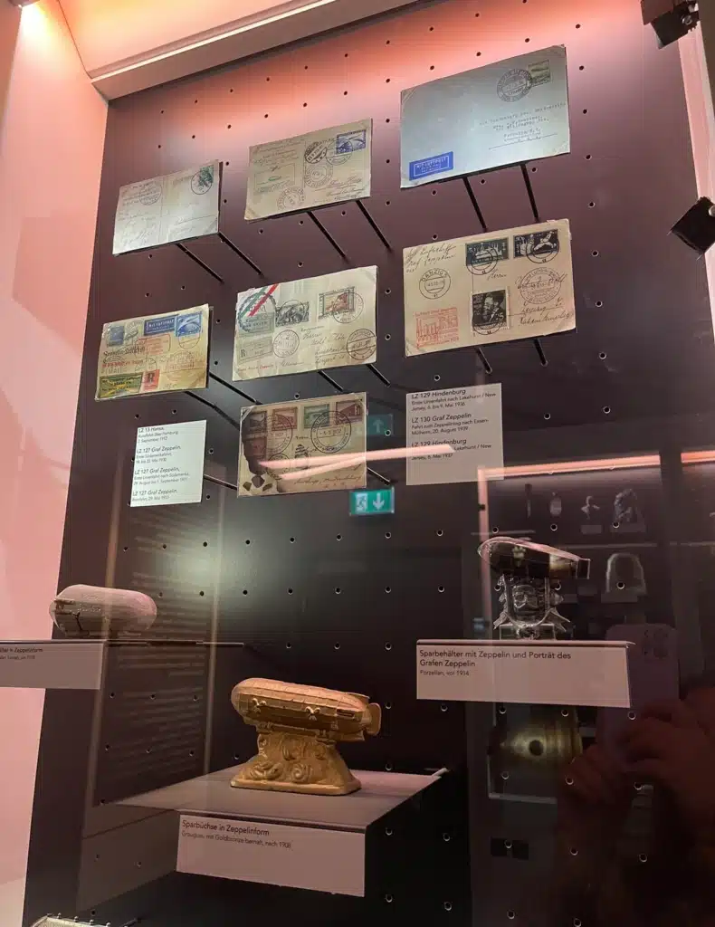 Vintage Zeppelin airmail letters and zeppelin-shaped money boxes on display at the Zeppelin Museum Friedrichshafen