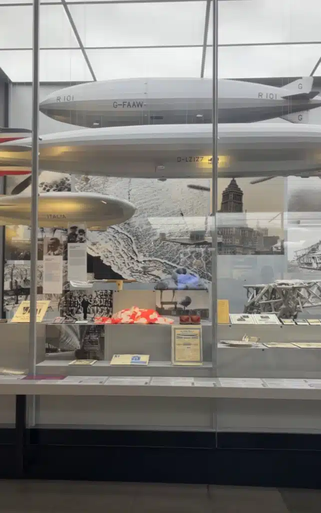 cale models of the R101 and Graf Zeppelin airships suspended above historic photos and artifacts at the Zeppelin Museum Friedrichshafen