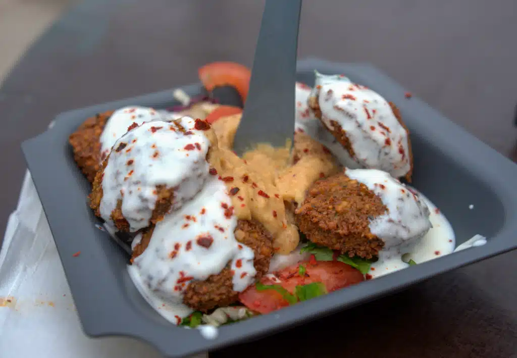 alafel plate topped with tzatziki and hummus at Konstanz Christmas Market food stall