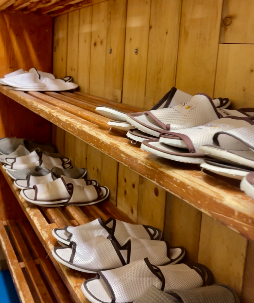 Shelves of guest slippers available at Rifugio Lagazuoi