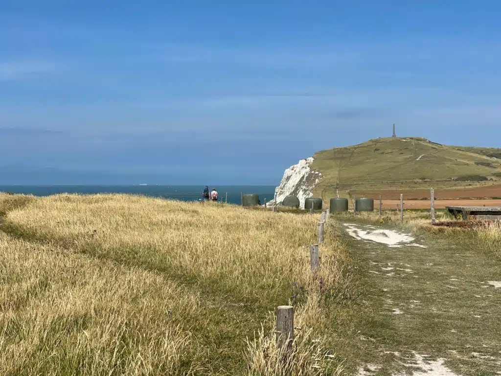 Dover Patrol Memorial on Cap Blanc-Nez seen from the GR120 coastal trail, with white chalk cliffs and the English Channel