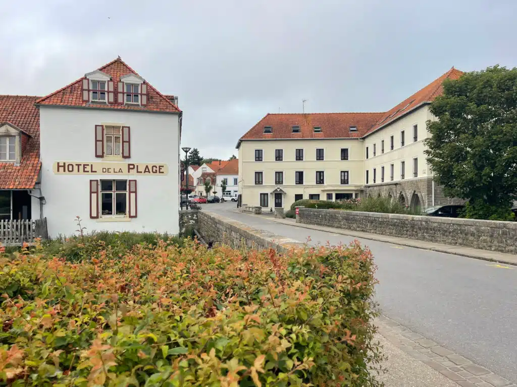 Hotel de la Plage in Wissant, a white building with red shutters on the main street near the beach, Côte d'Opale