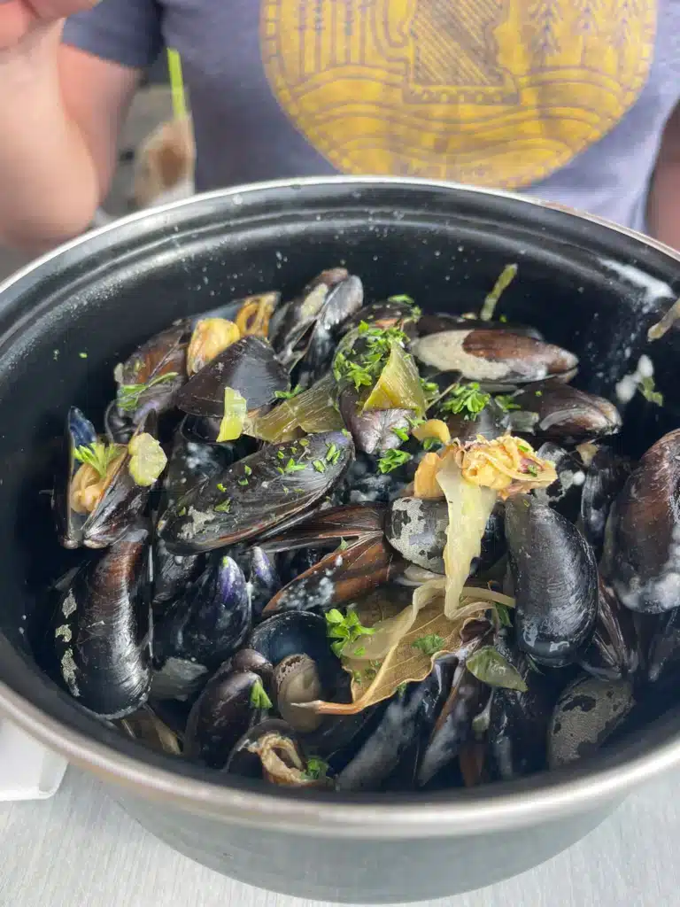 Mussels Pot of moules marinières with leeks and parsley at La Table d'Augustine in Wissant, France