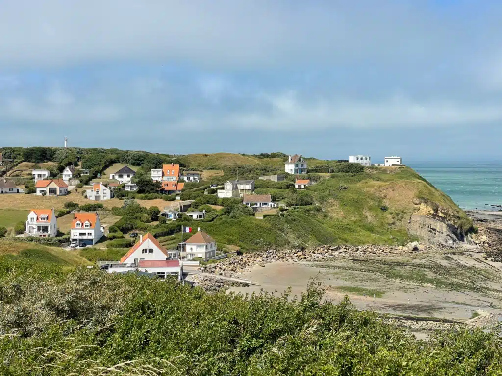 Village with lighthouse on the headland Houses and beach at Cap Gris-Nez with the lighthouse on the headland, seen from the GR120 coastal path