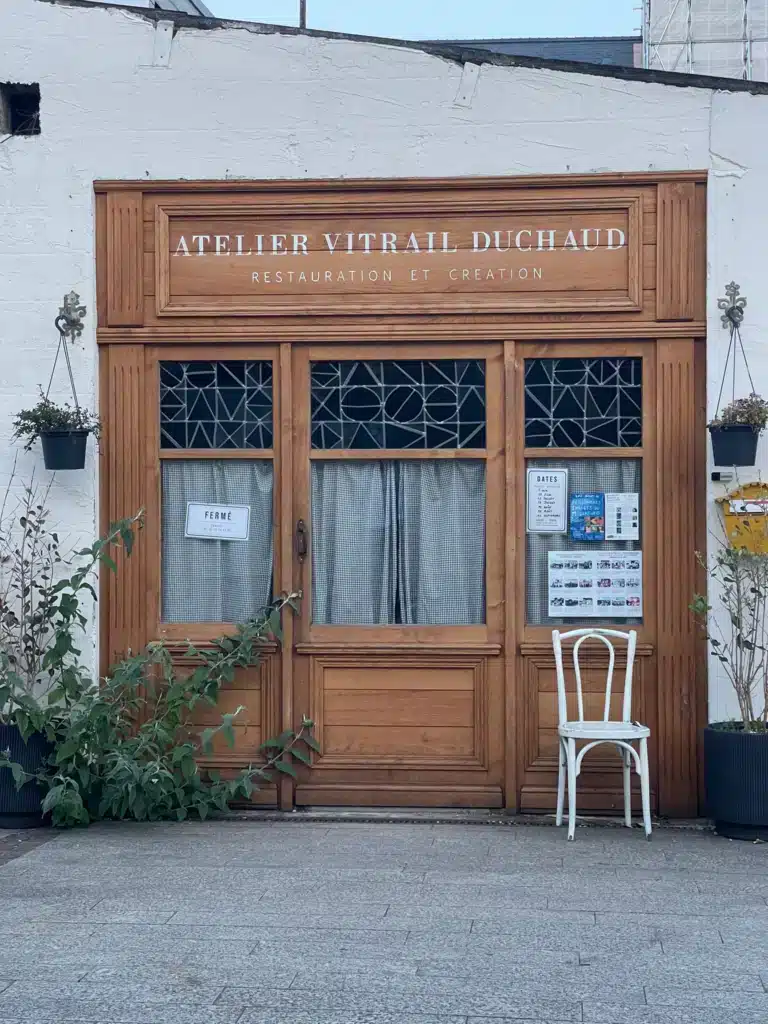 Wooden shopfront of Atelier Vitrail Duchaud, a stained glass restoration studio in Ambleteuse, Côte d'Opale